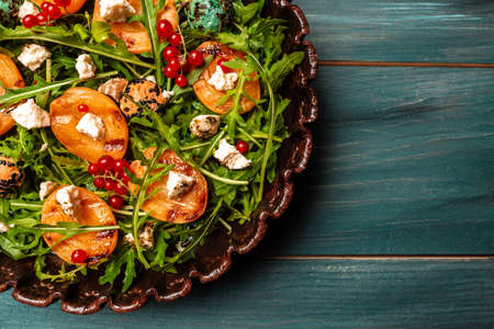 Salad with grilled peach, apricots, nectarines, Food recipe background. close up.の写真素材