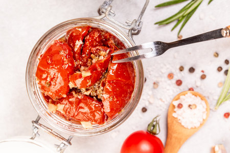 Bowl of sun dried tomatoes garlic, oregano, olive oil, Food recipe background. close up.の写真素材