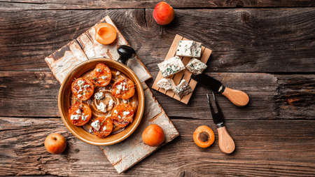 grilled peaches with and goat dor blue cheese, Delicious snack. Vegan food. flat lay. Banner. top view.の写真素材