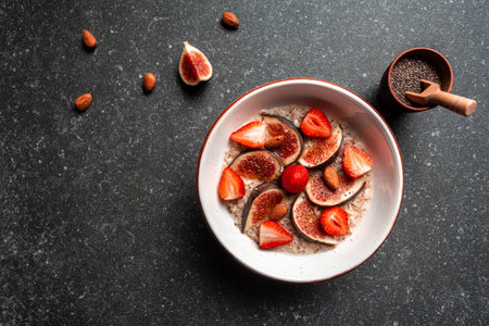 healthy diet breakfast. overnight oatmeal with chia seeds and fruits figs, strawberries, Gluten, lactose free, Fitness food. top view.の写真素材