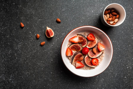 Ingredients for a healthy breakfast, oatmeal with strawberries, figs, chia seeds, and nuts, Healthy breakfast Gluten, lactose free, Fitness food.の写真素材