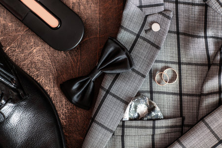 gold wedding rings. beautiful jewelry. Men's accessories. morning groom, Accessories groom morning, Details. Preparations for the wedding concept.の写真素材