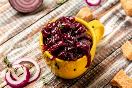 Homemade onion marmalade jam, confiture, chutney on a rustic wooden table. Delicious sauce. French cuisine, catering, banner, menu, recipeの写真素材