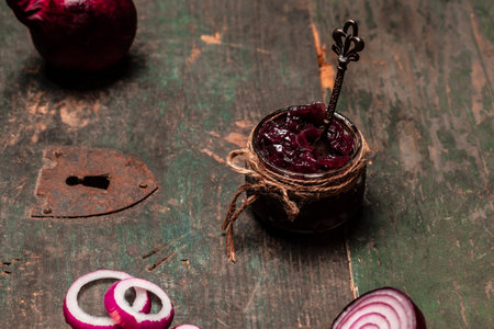 Homemade DIY natural healthy red onion marmalade jam, confiture, chutney in jar. Vegetable jam on wooden background. French cuisine, banner formatの写真素材