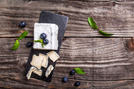 Camembert cheese or Brie noir, Gorgonzola with ash. Soft french cheese with ash, goat cheeses, home made cheese farmer. banner, catering menu recipe place for text, top viewの写真素材