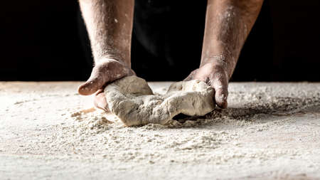 chef throwing up dough for pizza. Chef Making dough. Cooking bread. Kneading the Dough. Hands...