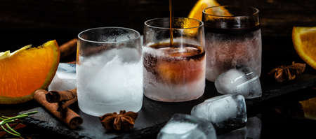 Shot drinks, Refreshing beverages at frosted glass. Delicious alcoholic drink. Glass of Liquor made with 56 herbs and spices, Long banner formatの写真素材