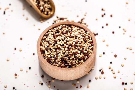 Red, black and white quinoa seeds on a white background. Healthy and gluten free food. banner, menu recipe place for text, top view.の写真素材