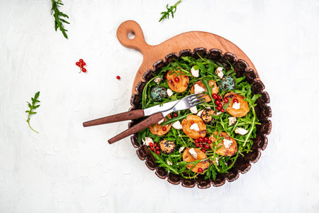 Fresh lettuce with grilled peaches, berries and goat cheese, Delicious snack on a light background, top view, Long banner format.の写真素材