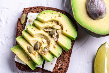 Bruschetta with avocado, cheese. The concept of eco products. Organic farm dairy products, cheeses, cereals. Parmesan, feta, goat cheese. background image. copyspace.の写真素材