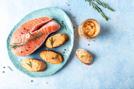 Smoked Salmon, mousse, pate and toasts on a ceramic plate, blue background, Jewish cuisine restaurant dish menu, dieting, cookbook recipe.の写真素材