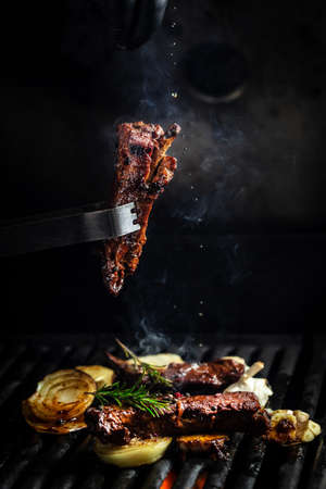 grilled barbecue ribs pork with rosemary. ribs with barbecue sauce. american cuisine. oncept cooking...