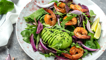 Fresh salad plate with shrimp, avocado, onion, mixed greens. Health food. clean eating. top view.の写真素材