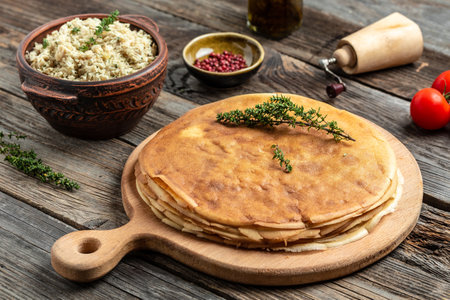 Pancakes or crepes roll with the chicken meat. Traditional Russian Maslenitsa festival meal on...