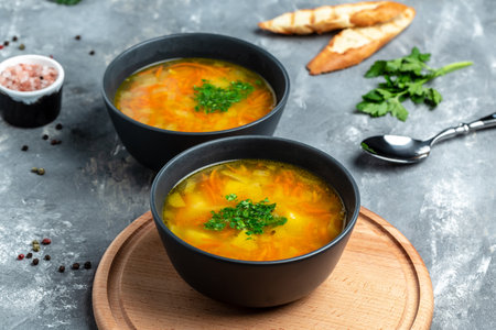 Red lentil soup. Traditional turkish or arabic lentil and vegetable spicy soup, healthy vegan food. top view.の写真素材