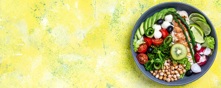 Grilled chicken meat and fresh vegetable salad on yellow background. Healthy and detox food concept. The ketogenic diet. Buddha bowl dish, Long banner format, top view,の写真素材