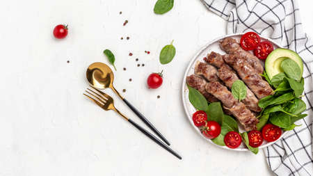 Baked minced meat wrapped in bacon with spinach, avocado and cherry tomato, Healthy fats, clean...