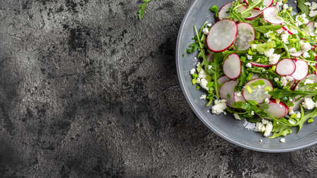 Spring salad with radishes and green onions. Healthy food trend.の写真素材
