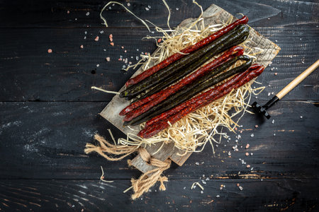 long dry sausages, Snack for dried beer, banner, menu, recipe place for text. top view.の写真素材