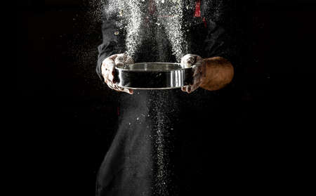 Preparing yeast dough made from wheat flour. hands knead the dough make bread, pasta or pizza.の写真素材