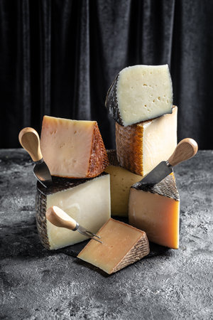 Different sorts of cheese, traditional pieces of Spanish, French, Italy cheese. Long banner format.の写真素材