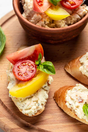 bruschetta with tomatoes, cream cheese and basil. Delicious breakfast or snack, Clean eating, dieting, vegan food concept. top view.の写真素材