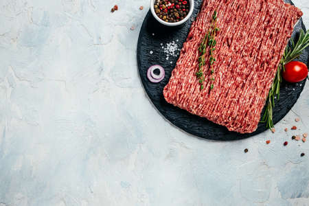 Fresh raw minced beef on light background. banner, menu, recipe place for text, top view.の写真素材