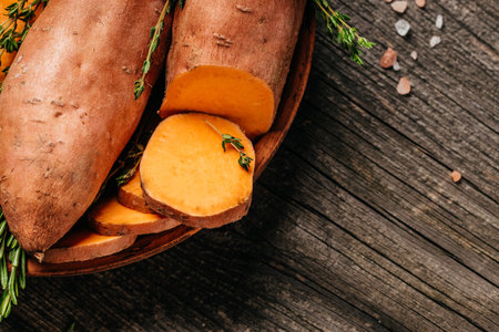 Raw sweet potatoes. vegan food ingredient. sweet potatoes or batatas. place for text, top view.の写真素材