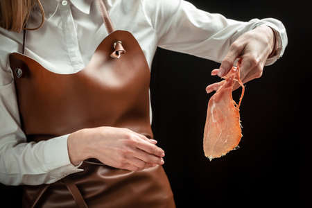 Dry Spanish ham, Jamon Serrano, Iberian ham cutter. Slicing Spanish jamon iberico. Spanish jamon and traditional food.の写真素材