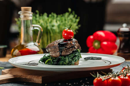 Medallions steaks from the beef tenderloin with spinach, Delicious balanced food concept,の写真素材