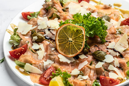 salmon carpaccio with parmesan cheese, capers, parmesan and cherry tomatoes. Food recipe background. close up.の写真素材