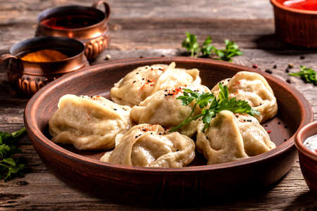 Traditional manti food on plate, top view. The concept of oriental cuisine. Uzbek food manty dumplings. Uzbek food. banner, catering menu recipe place for text.の写真素材