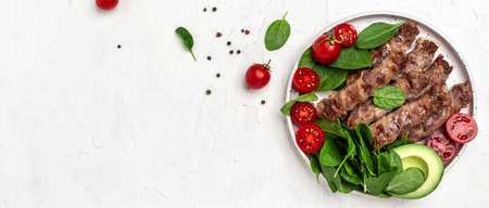 Baked minced meat wrapped in bacon with spinach, avocado and cherry tomato, Healthy fats, clean...