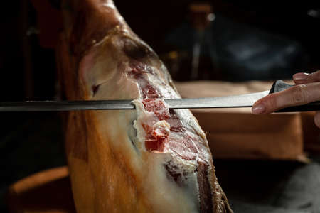 Iberian ham cutter. Traditional Spanish ham, Slicing of dry-cured. Hamon is forty-eight weeks old. gastronomic products of Spain.の写真素材