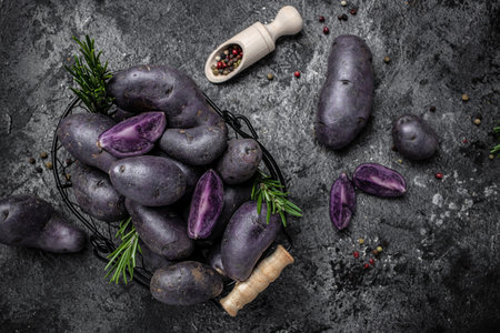 Organic purple sweet potato. Raw sweet potatoes or batatas. pomoea batatas. Batata potatoes. vegan food ingredient. banner, menu, recipe place for text, top view.の写真素材