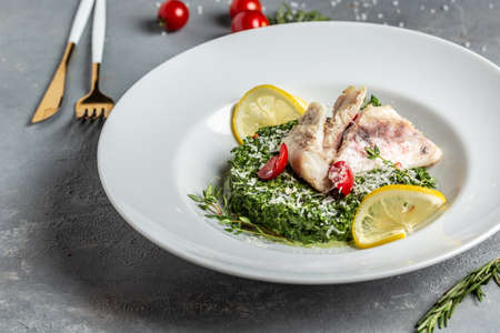 Pike perch fillet with mussels, peas, asparagus and vegetable cream sauce. Fried fish with stewed...