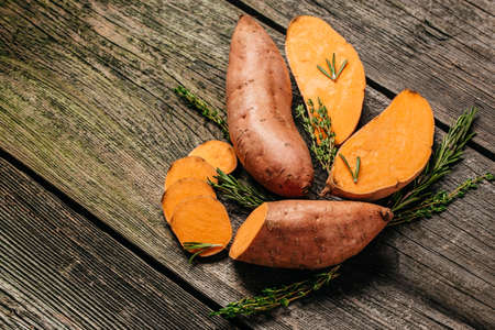 Louisiana Beauregard Sweet Potatoes, Organic orange sweet potatoes or batatas. vegan food ingredient. banner, menu, recipe place for text, top view,の写真素材