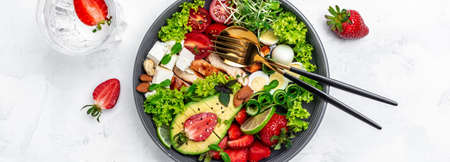 Ketogenic diet food, chicken fillet, quinoa, avocado, avocado, feta cheese, quail eggs, strawberries...