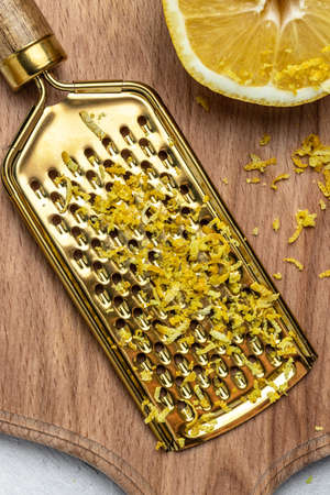 Grater peel and lemon zest Ready to Cook, vertical image. top view,