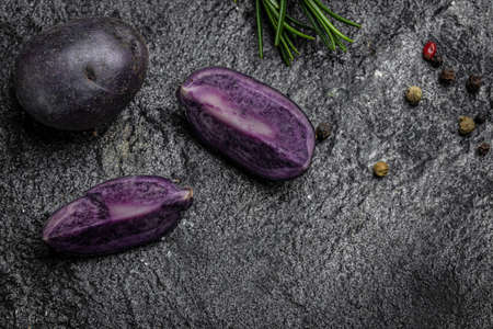 Organic purple sweet potato. Raw sweet potatoes or batatas. pomoea batatas. Batata potatoes. vegan food ingredient. banner, menu, recipe place for text, top view.の写真素材