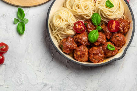 Pan with Italian pasta with tomato sauce and meatballs. Restaurant menu, dieting, cookbook recipe top view.の写真素材