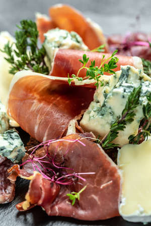 Appetizers. Sandwich with prosciutto and blue cheese. antipasti with red wine. vertical image. top...