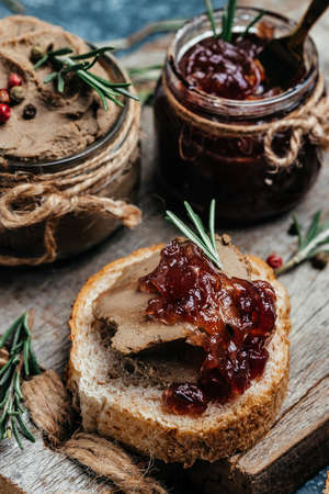 Belgian duck liver pate with onion marmalade jam confiture. Fresh homemade chicken liver pate with greens. banner, menu, recipe place for text, top view.の写真素材