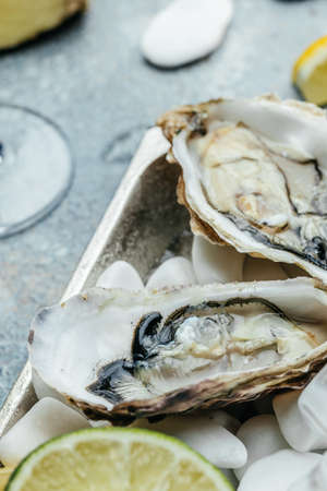 Oysters on the half shell. Fresh oysters served with cocktail sauce and fresh lemons. Oyster dinner...