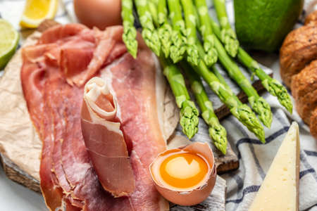 Asparagus. bunch of fresh asparagus, jamon, ham, prosciutto Pickled Green Asparagus. close up. Keto Paleo diet menu, top view,の写真素材
