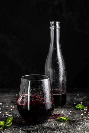 low alcohol drink, chilled colorful beverages on rustic black background. summer party. Alcoholic drink concept. vertical image. place for text.の写真素材