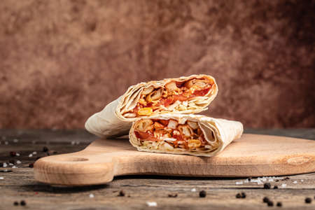 Vegan Kebab, pita, gyros, shaurma, wrap sandwich stuffed with french fries, fresh vegetables, sauce....