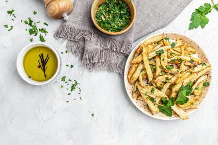 Healthy Homemade food, roasted parsnips side dish on plate. Delicious vegetarian breakfast or snack, Clean eating, dieting, vegan food concept. top view,の写真素材