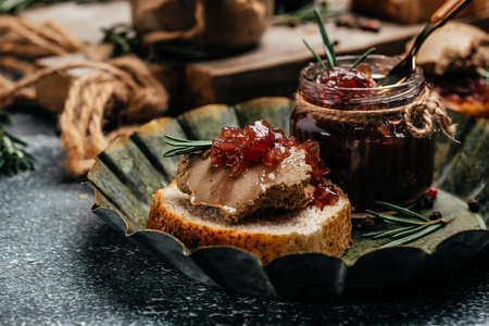 Liver pate with onion marmalade jam confiture. Fresh homemade chicken liver pate with greens. Restaurant menu, dieting, cookbook recipe.の写真素材