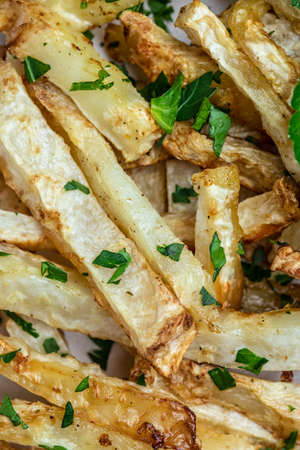 Roasted Parsnips side dish on plate. Delicious vegetarian breakfast or snack, Clean eating, dieting,...